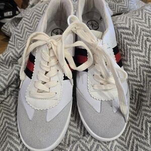 Stylish White and Gray Sneakers with Red and Black Stripes